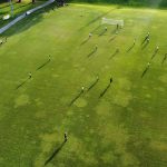 aerial view of teams playing soccer on the field